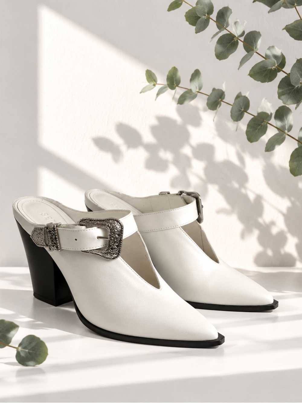 SCHUTZ White Pointed Mule Heels with Ornate Silver Buckle